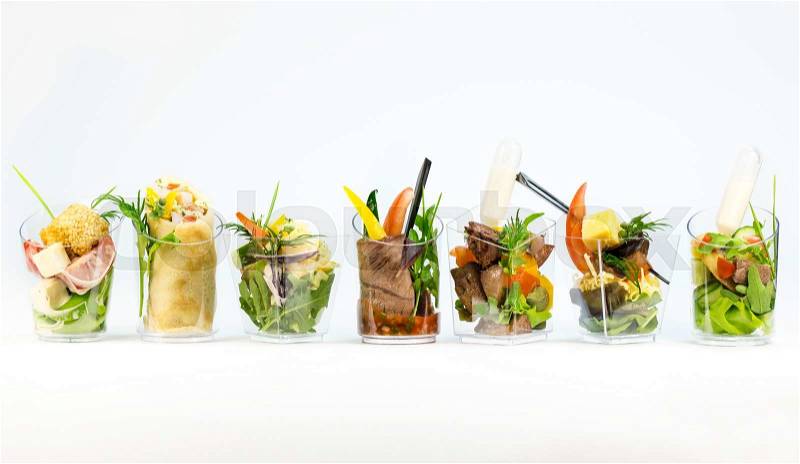 Mini Canape with meat and vegetables in plastic cups, stock photo