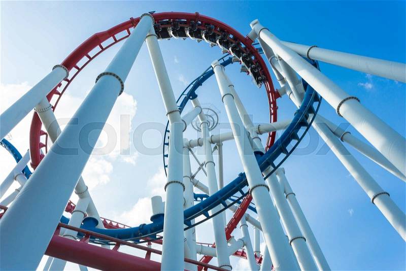 A roller coaster\'s loop with blue sky, stock photo