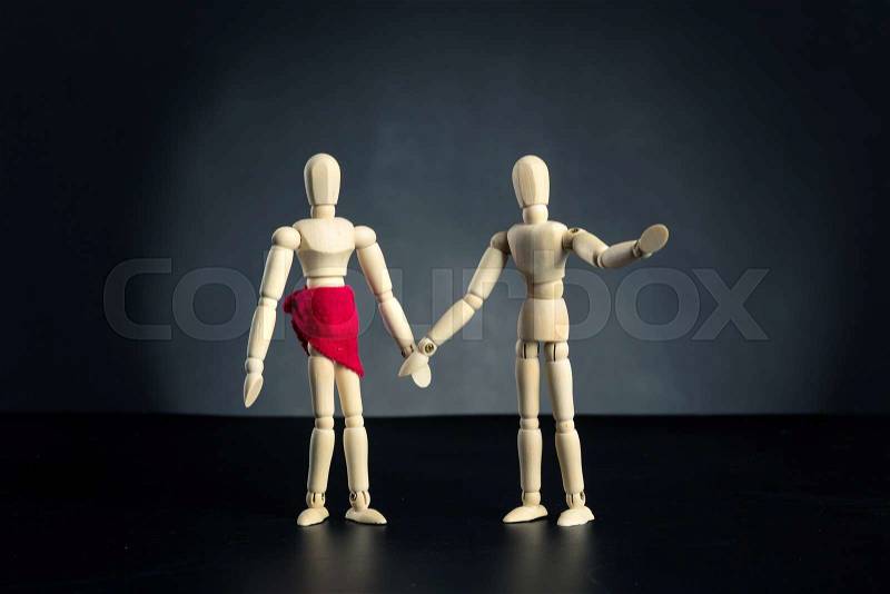 Wooden carved figures, woman and woman, stock photo