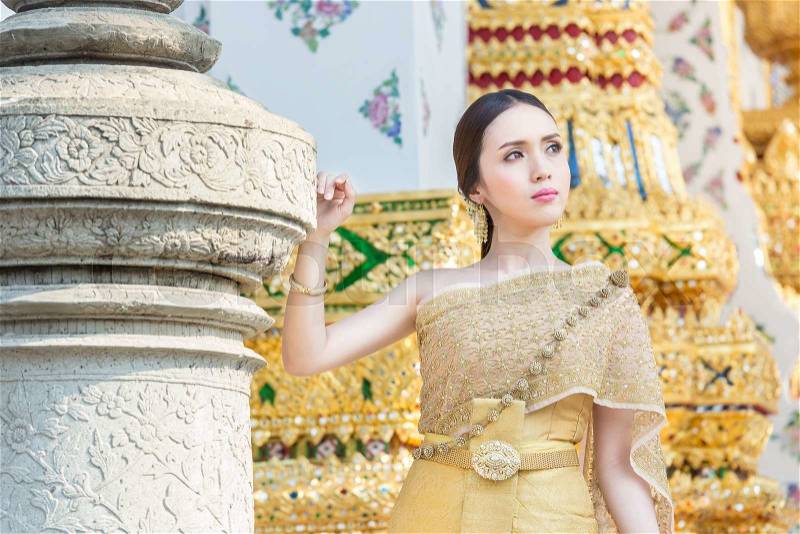 Thai woman wearing Thai traditional bridal dresses (Thai Chakri). Dress of Thai silk and metal thread brocade with Bead and sequin embroidery, stock photo