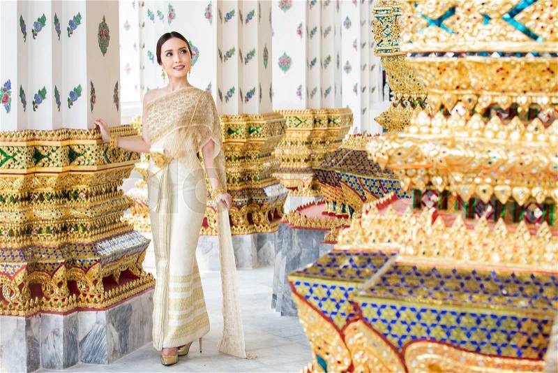 Thai woman wearing Thai traditional bridal dresses (Thai Chakri). Dress of Thai silk and metal thread brocade with Bead and sequin embroidery, stock photo