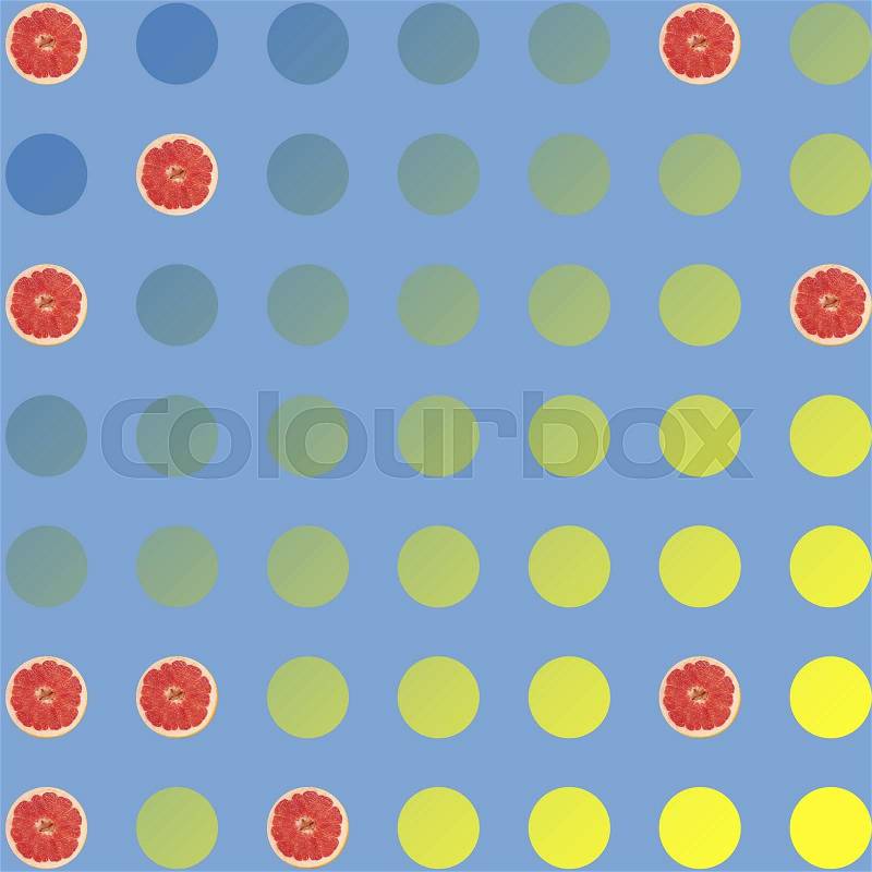 Points of yellow and blue, round slices of grapefruit on blue background, stock photo