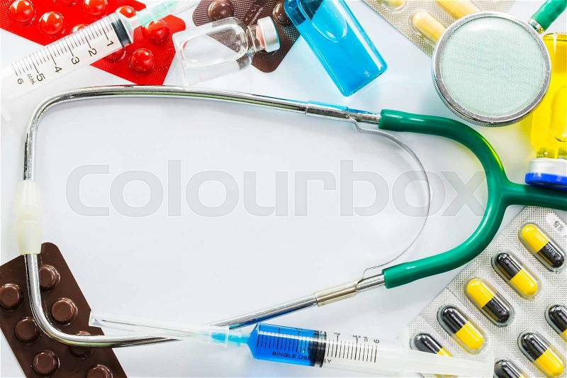 Medical frame of Stethoscope pill ampoules and syringe isolated on white background, stock photo