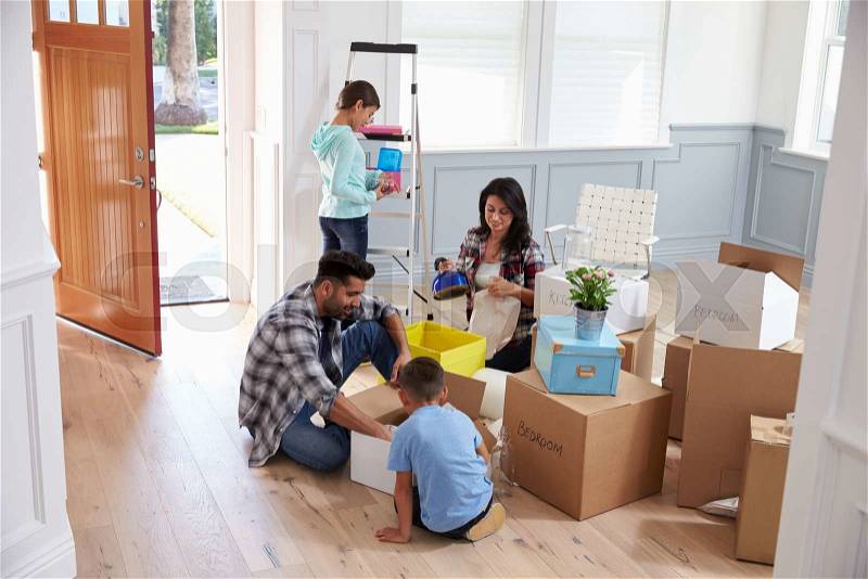 Hispanic Family Moving Into New Home, stock photo