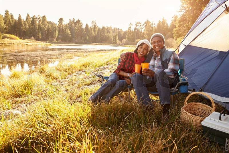 Portrait Of Senior Couple On Autumn Camping Trip, stock photo