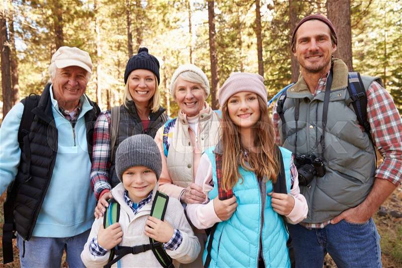 Multi generation family on forest hike, waist up portrait, stock photo
