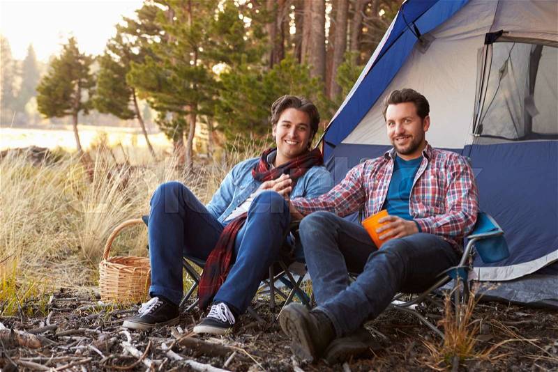 Portrait Of Male Gay Couple On Autumn Camping Trip, stock photo
