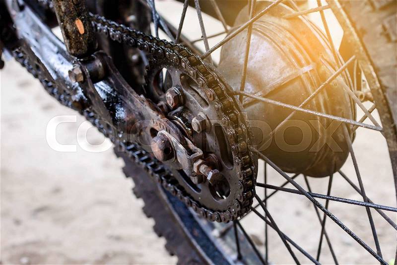 Old dirty motorcycle chain on wheel. , stock photo
