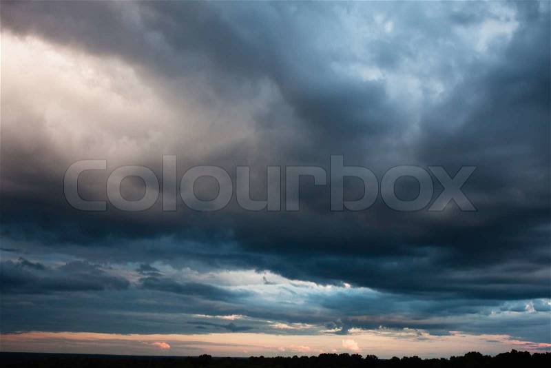 Dark stormy sky before sunset, stock photo