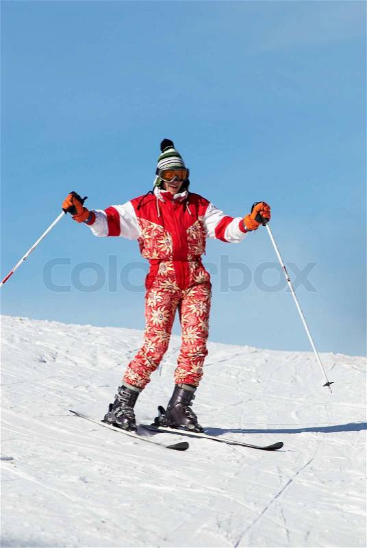 Happy ski girl in red, stock photo