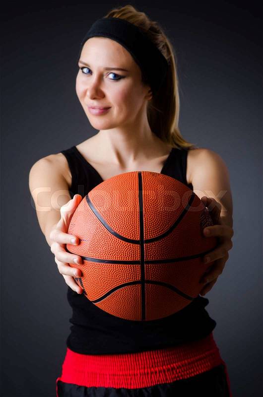 Woman with basketball in sport concept, stock photo
