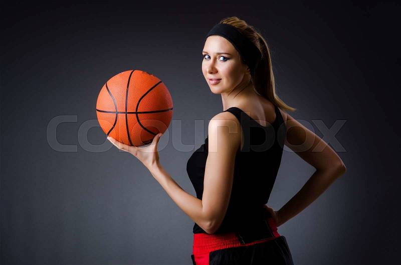 Woman with basketball in sport concept, stock photo