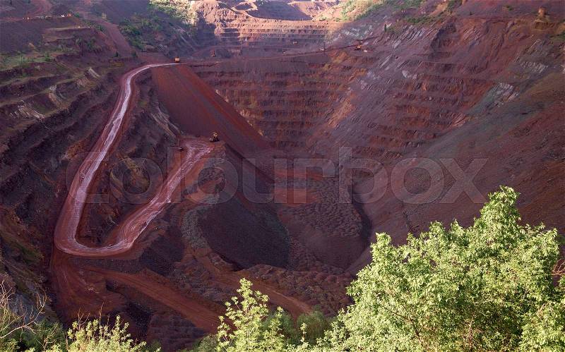 View inside the iron oxid quarry with trails on slopes in Krivyi Rih, Ukraine, stock photo