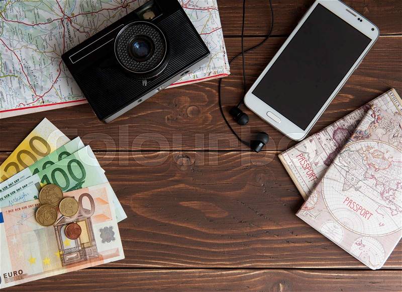 Other Travel Article on a wooden background, stock photo