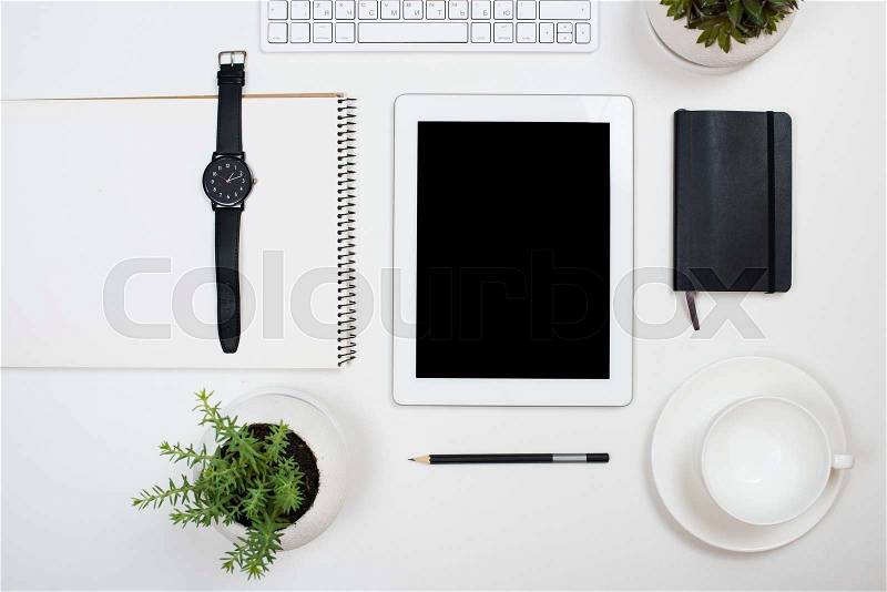 Tablet mock-up and office supplies on white tabletop background, contemporary workspace, stock photo