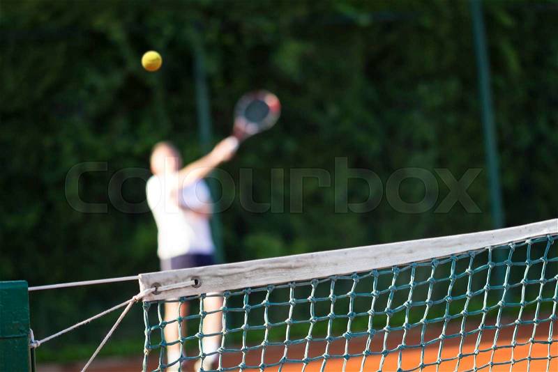 Tennis net, Man plays tennis, blurred motion, stock photo