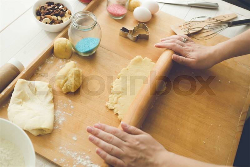 Woman making sweet dough for cookies, stock photo