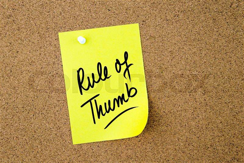 Rule Of Thumb written on yellow paper note pinned on cork board with white thumbtack, copy space available, stock photo