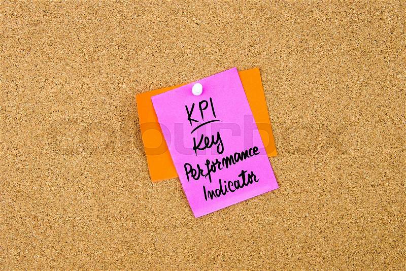 Business Acronym KPI Key Performance Indicator written on paper note pinned on cork board with white thumbtack, copy space available, stock photo