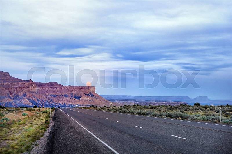 Twilight view of desert road in USA, Utah , stock photo