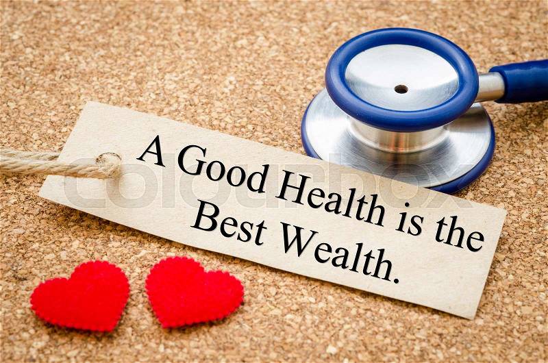 A good health is the best wealth card and stethoscope with red heart on wood table. Medical concept, stock photo