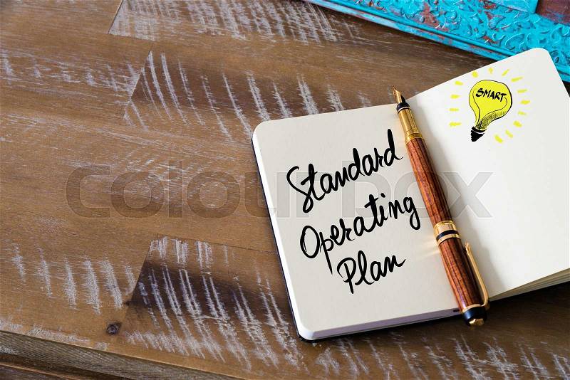 Handwritten text Standard Operating Plan with fountain pen on notebook. Concept image with copy space available, stock photo