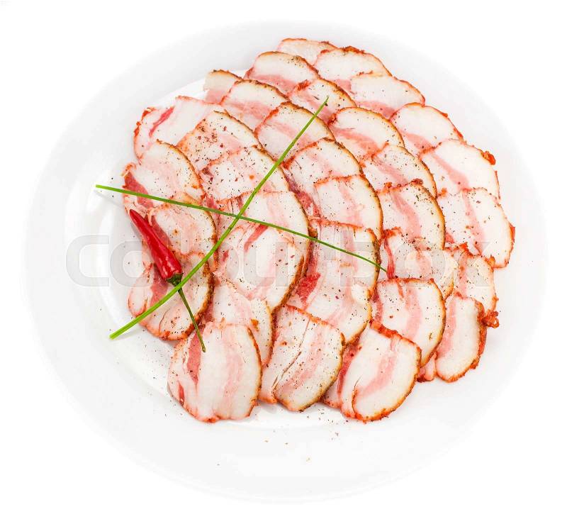 Bacon, onion and pepper on a plate in a restaurant, stock photo