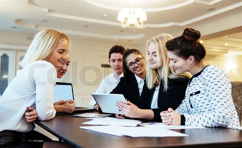 Group of students studying using a laptop, stock photo