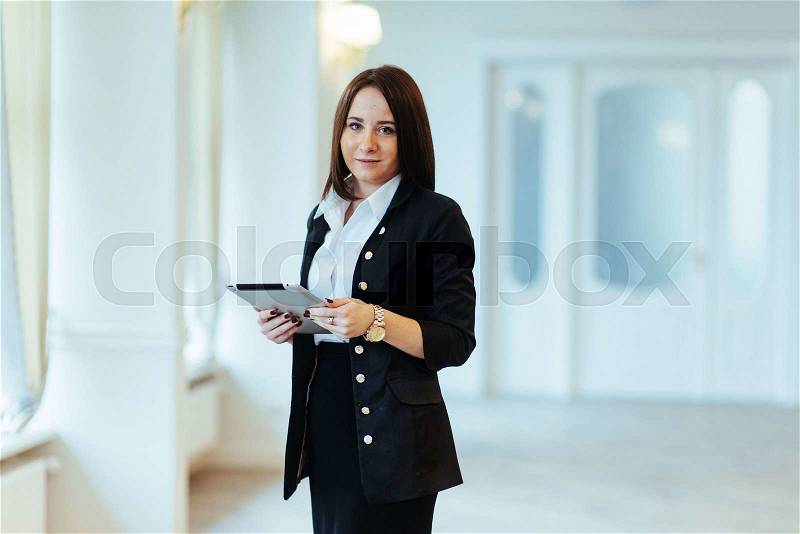 Smiling woman with tablet computer, stock photo