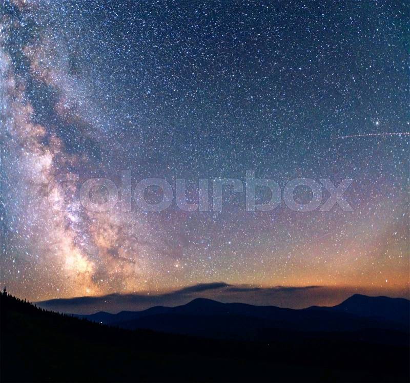 Fantastic winter meteor shower and the snow-capped mountains, stock photo