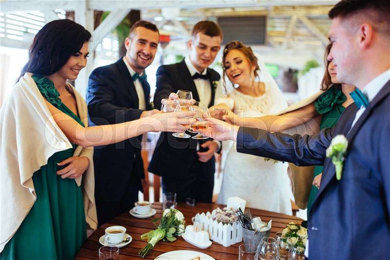 Brides wedding day with friends in a cafe, stock photo