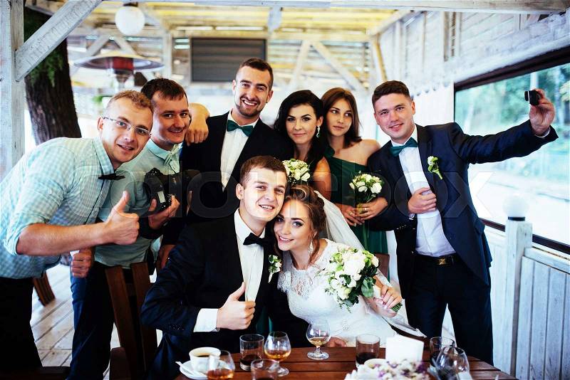 Brides wedding day with friends in a cafe, stock photo