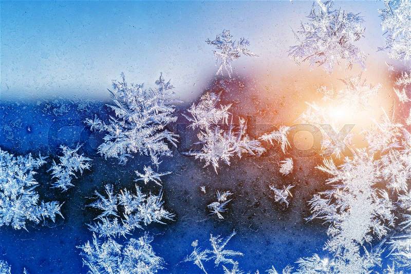 Frosty natural pattern on winter window, stock photo