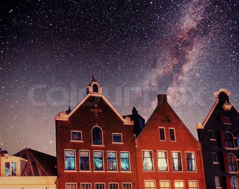Beautiful night in Amsterdam. Night illumination of buildings, stock photo