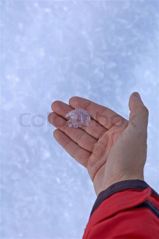 Winter crystal on palm, stock photo