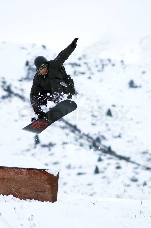Black snowboarder fly, stock photo