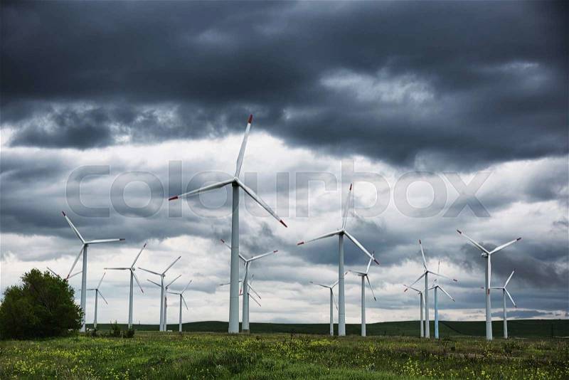 Wind power plant and storm sky, stock photo