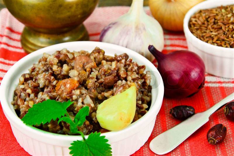 Pilaf with Meat, Carrots and Red Rice Studio Photo, stock photo