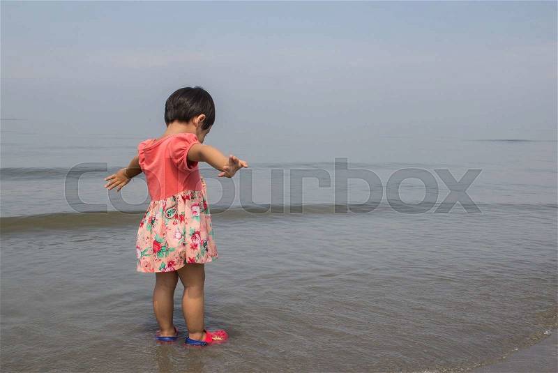 The girl was glad to see the sea, stock photo