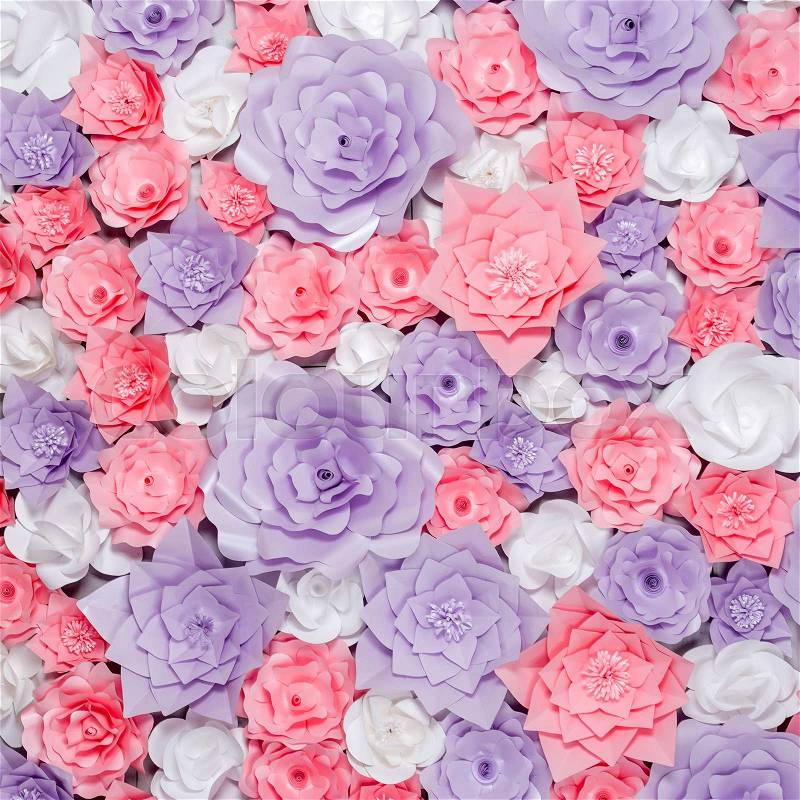 Colorful paper flowers background. Floral backdrop with handmade roses for wedding day or birthday, stock photo
