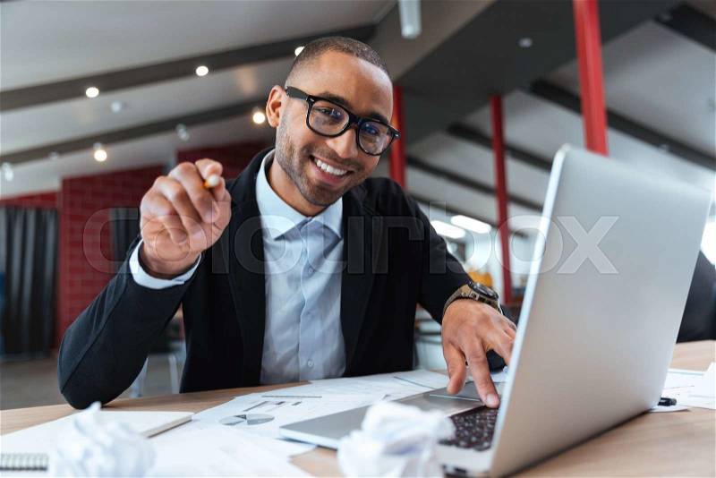 Young handsome businessman pointing at you , stock photo