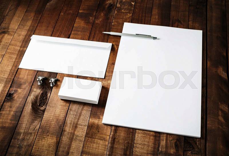 Blank business brand template on wooden table background. Blank stationery set. Corporate identity template. Letterhead, business cards, envelope and pen, stock photo