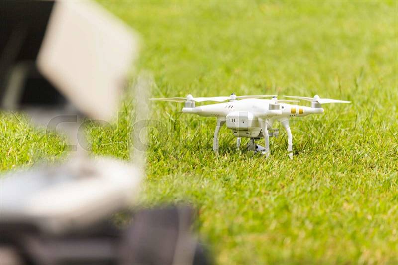 White drone with camera, stock photo