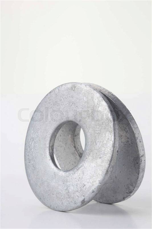 Flat silver washers on a white background, stock photo