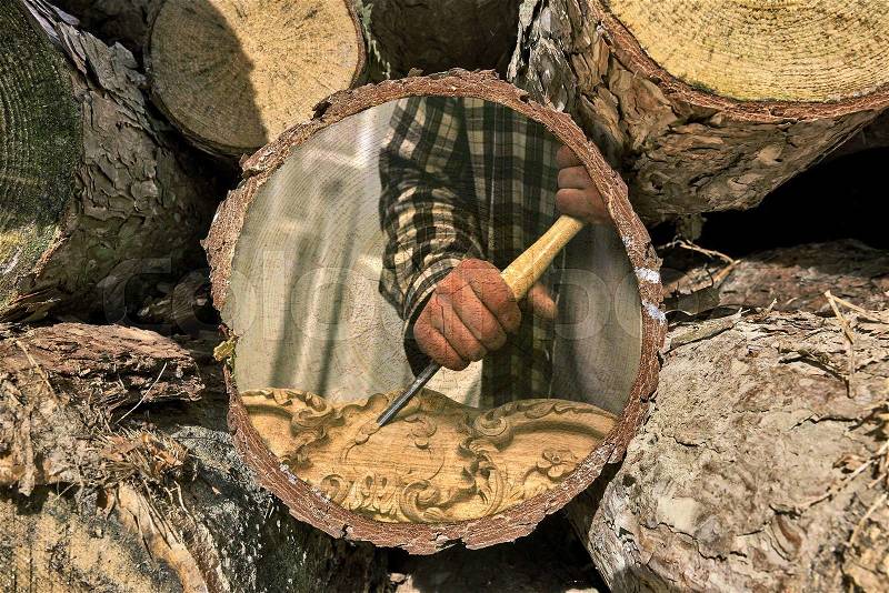 Part of woodpile and Woodworker at work painted on texture, stock photo