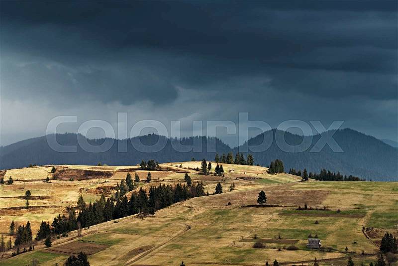 Spring rain in mountains. Thunder and clouds, stock photo