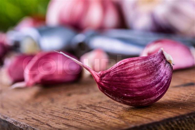 Garlic. Fresh garlic. Red garlic. Garlic press. Violet garlic.Garlic background. garlic bulbs, stock photo