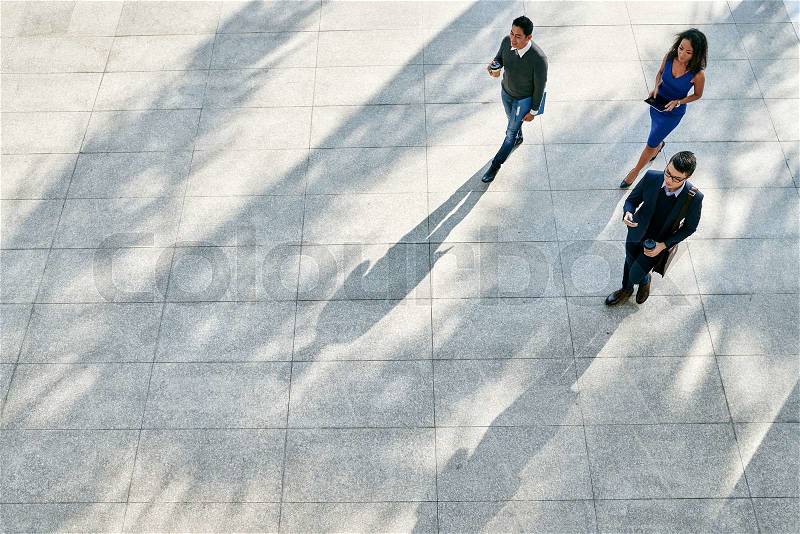 Vietnamese business people hurrying to work, view from above, stock photo