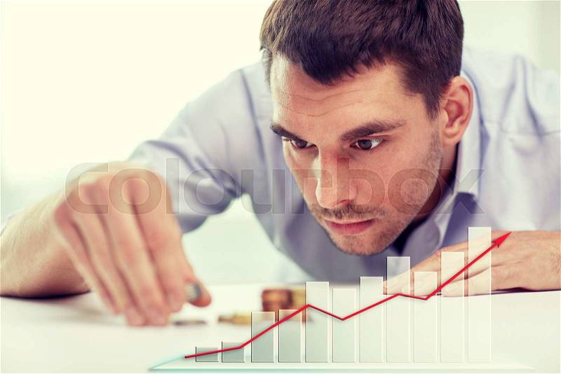 Business, people, finances, statistics and money saving concept - businessman putting coins into piles and growing chart, stock photo