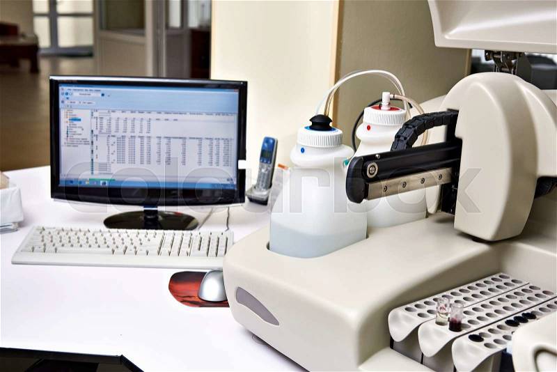 Biochemical analyzer and computer in laboratory of wine industry, stock photo